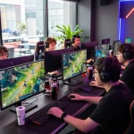 Engaged gamers enjoying Esports betting Singapore in a vibrant gaming lounge with screens displaying live matches.