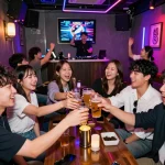 Experience 제주유흥 at a lively karaoke bar in Jeju Island, where friends enjoy drinks and music.